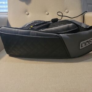 Shoulder massager with multiple settings.  Sits around shoulders or lower back.